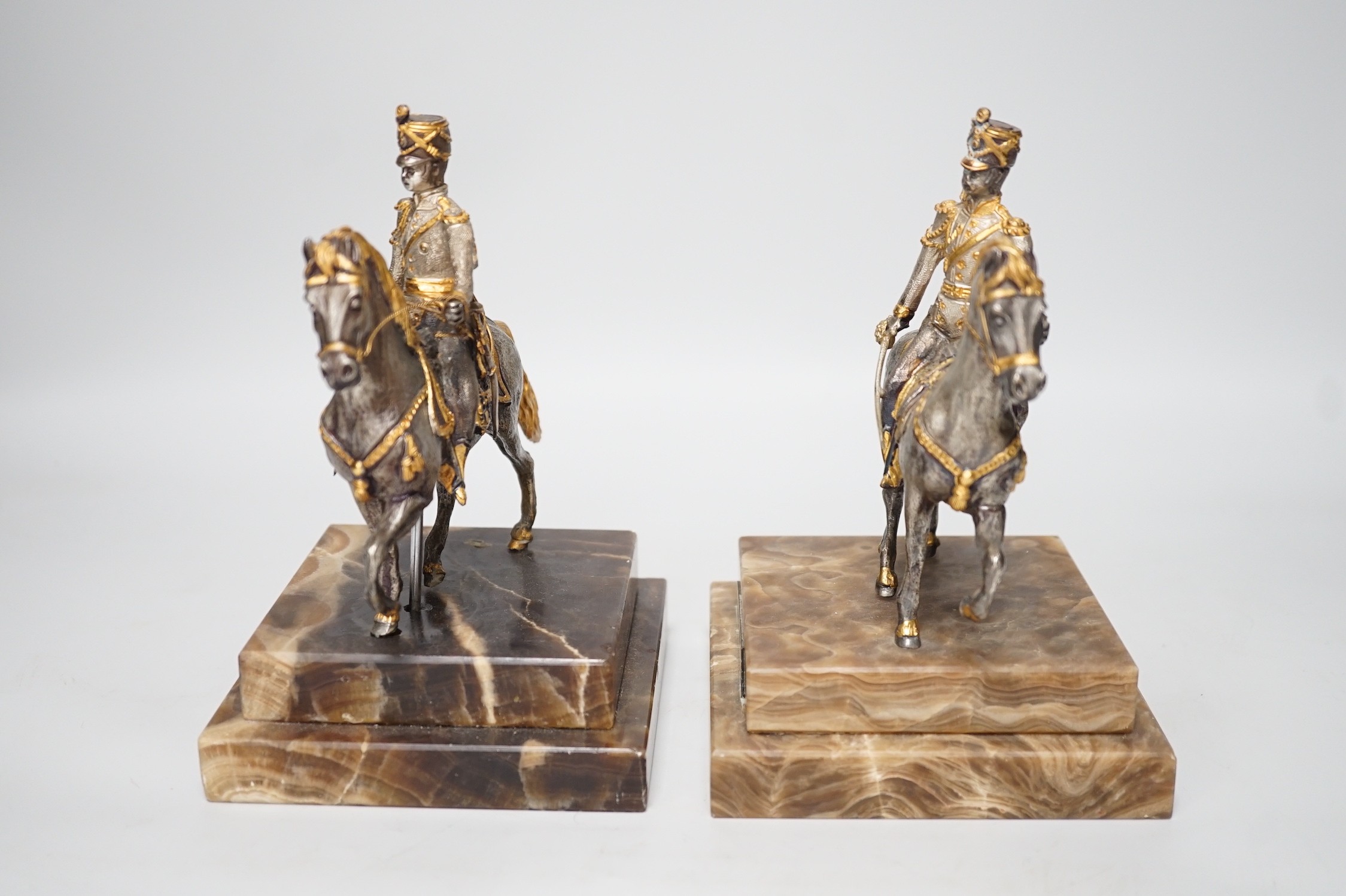 Two limited edition gilt bronze of horseback riders on marble bases, plaques read ‘Cav. AUSTRIACO 1825 1/200’ and ‘26/200’ 17cm